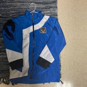 White and blue warm up suit. Brand is OWNYC based in New York.